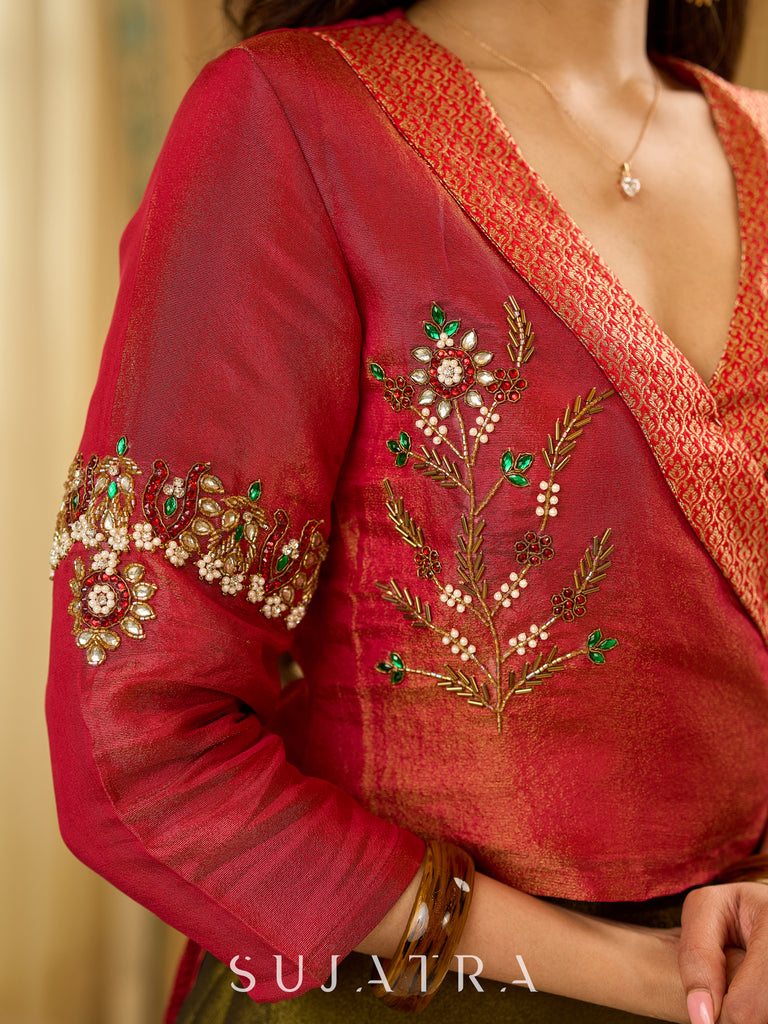 Luminous Green tissue lehenga with a classic Red Angrakha choli featuring intricate hand embroidery.