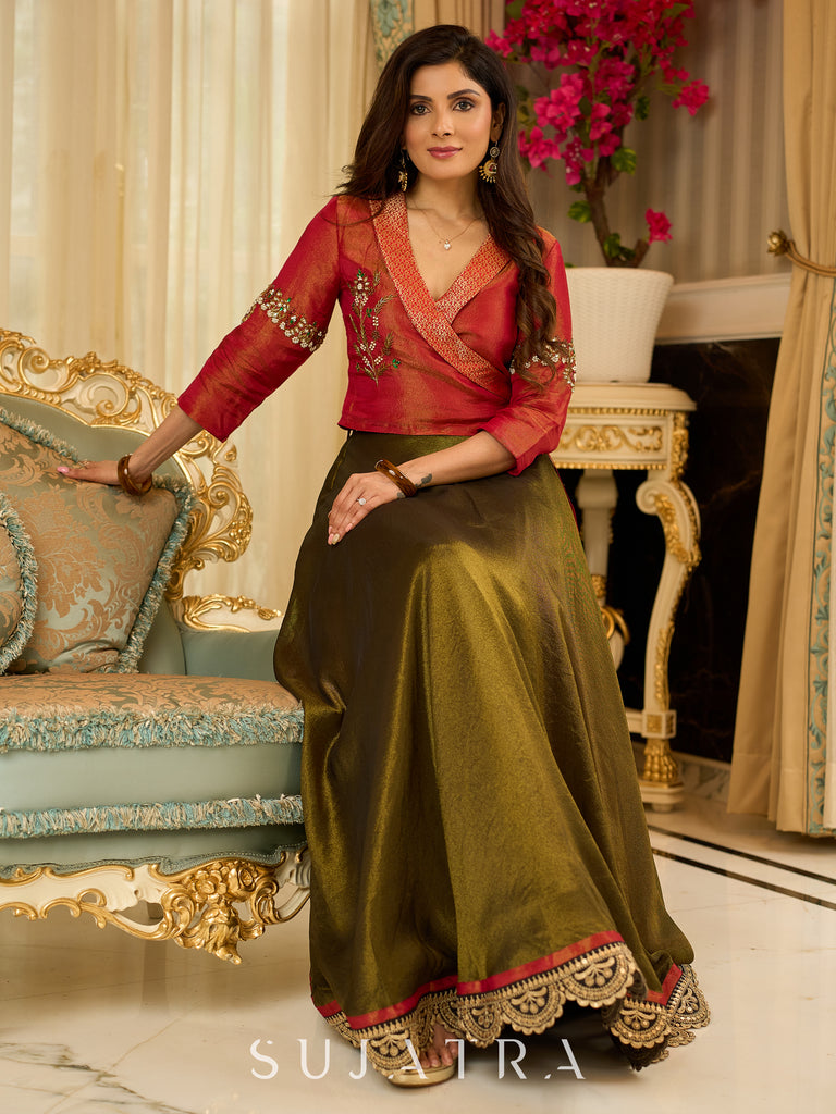 Luminous Green tissue lehenga with a classic Red Angrakha choli featuring intricate hand embroidery.