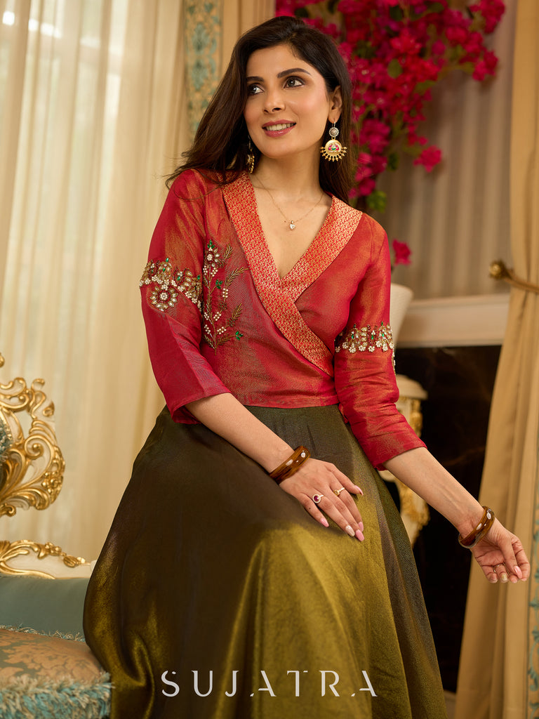 Luminous Green tissue lehenga with a classic Red Angrakha choli featuring intricate hand embroidery.