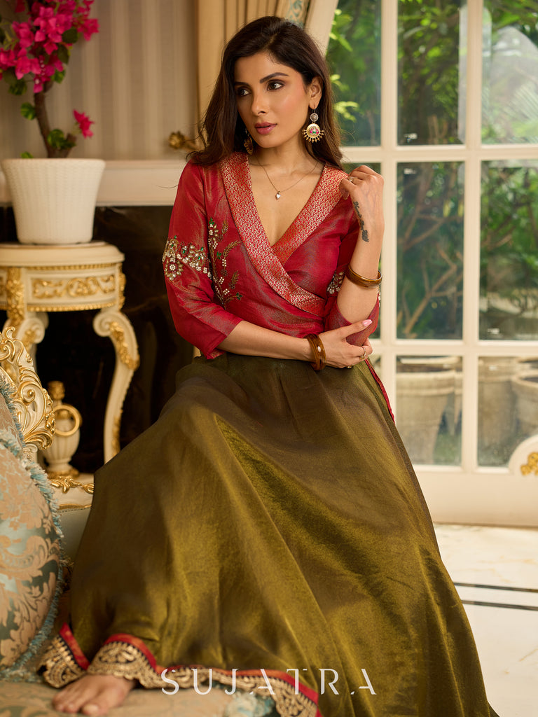 Luminous Green tissue lehenga with a classic Red Angrakha choli featuring intricate hand embroidery.