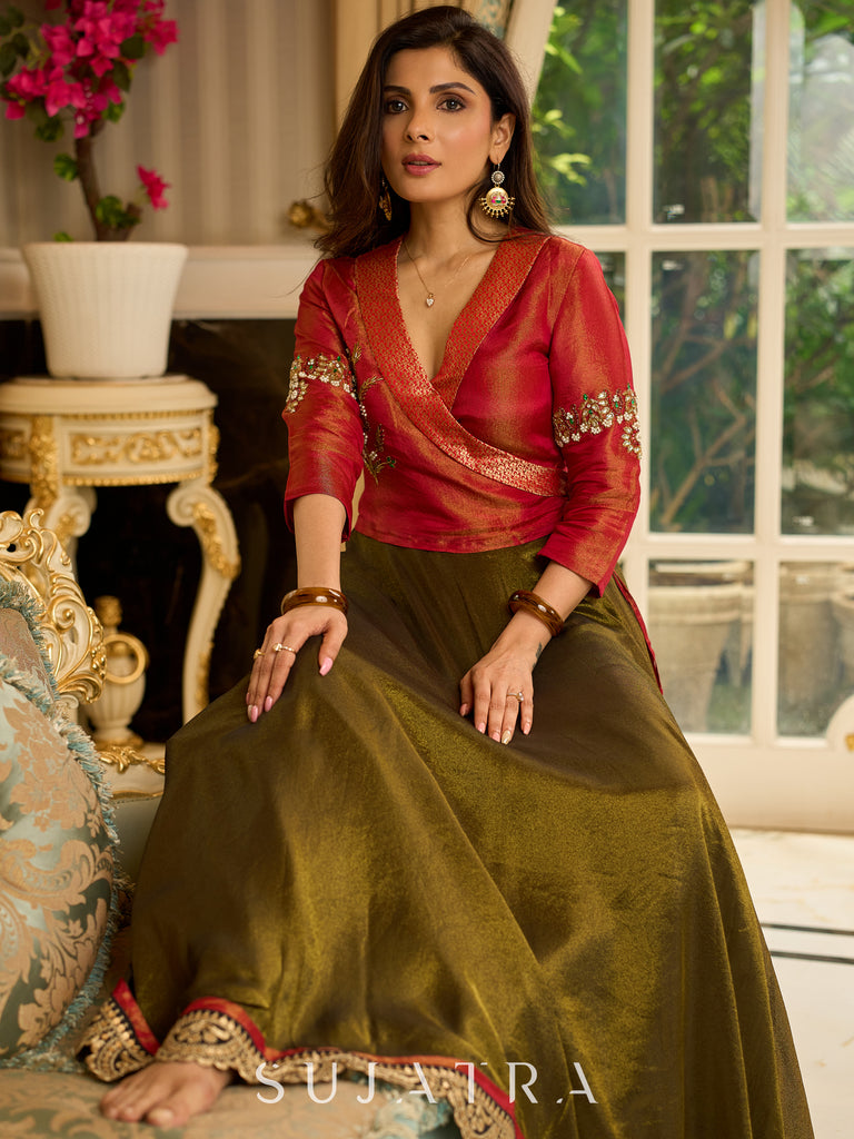 Luminous Green tissue lehenga with a classic Red Angrakha choli featuring intricate hand embroidery.