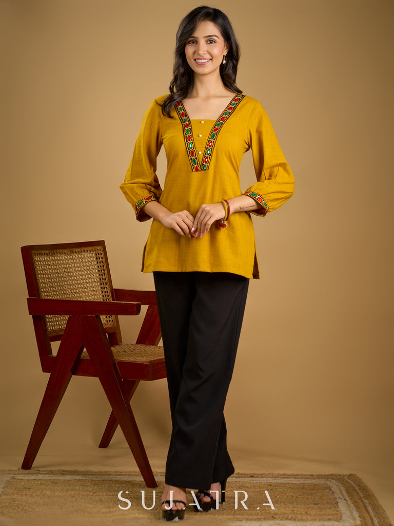 Elegant handcrafted mirror work mustard cotton top.