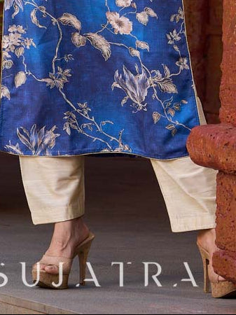 Graceful cream cotton-silk pants with delicate gold accents.