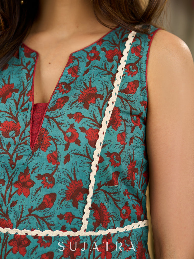 Flowy Green Floral Printed Cotton Dress with Flared Silhouette, Maroon Contrast Trims, and Crochet Lace Edges