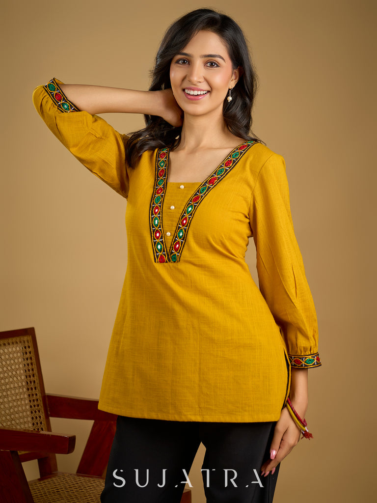 Elegant handcrafted mirror work mustard cotton top.