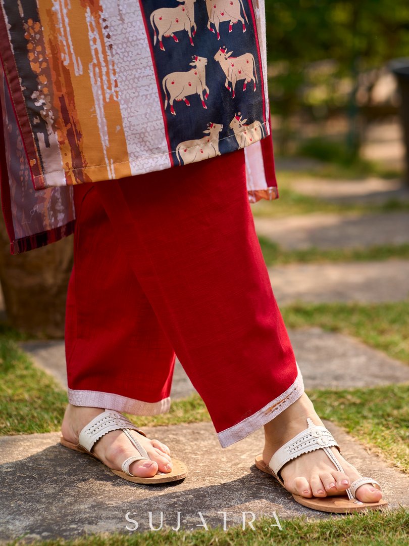 Elegant red cotton pants with a traditional cow-motif border