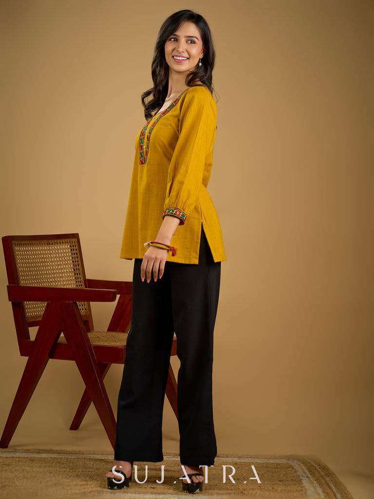 Elegant handcrafted mirror work mustard cotton top.