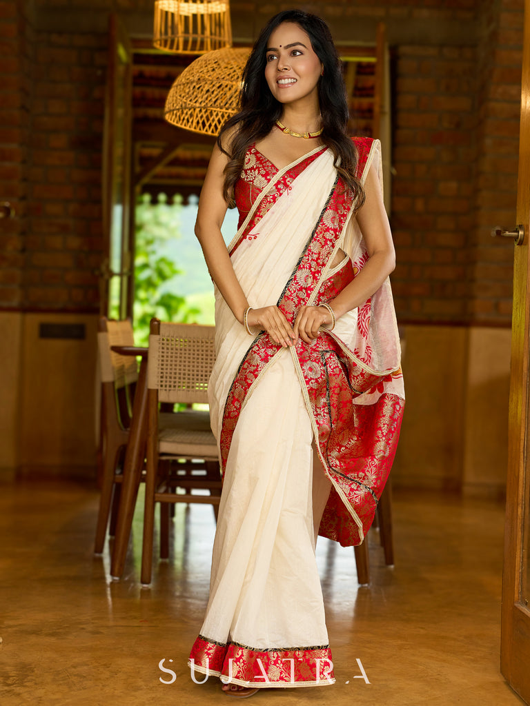Heritage white Chanderi saree with benarasi border featuring artisanal hand-painted floral motifs