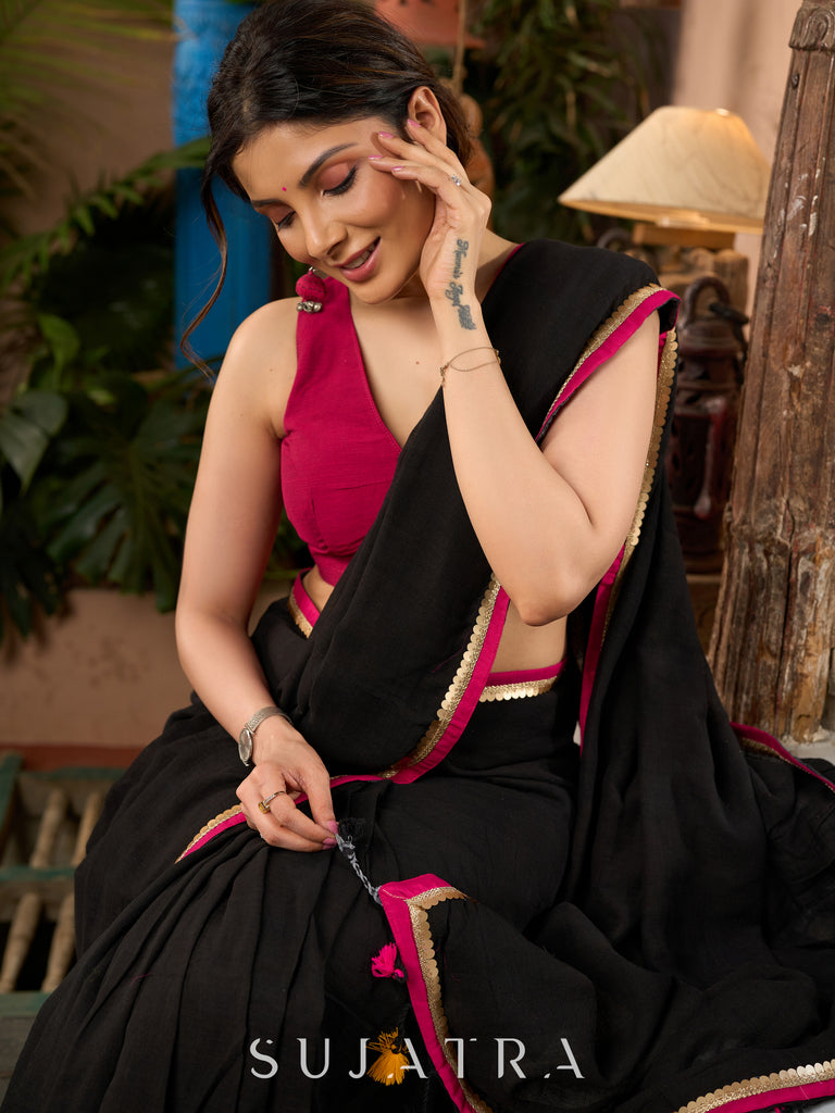 Pure black cotton saree with zari border & pom poms
