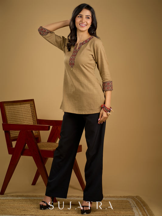 Ethnic dark beige cotton top highlighted with elegant ajrakh detail.