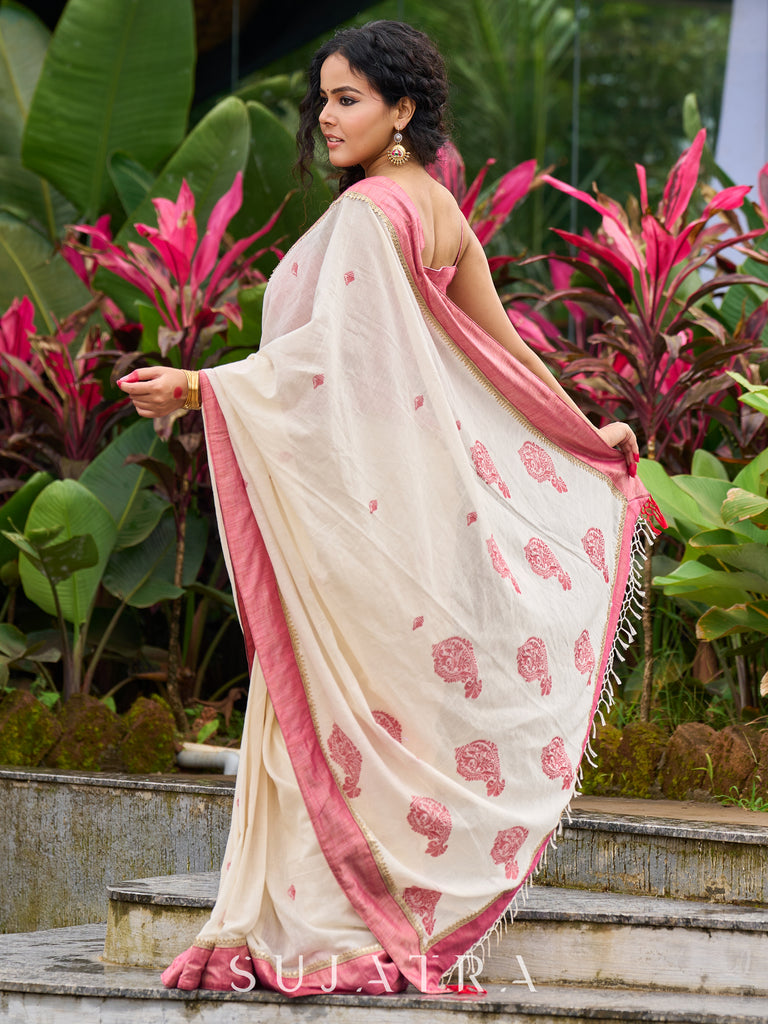 Ivory Jamdani cotton saree with delicate pink woven paisley motifs
