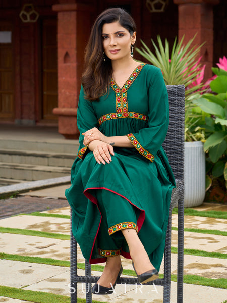 Beautiful Kutch mirror embroidery enriches this flared green rayon kurta - pant optional
