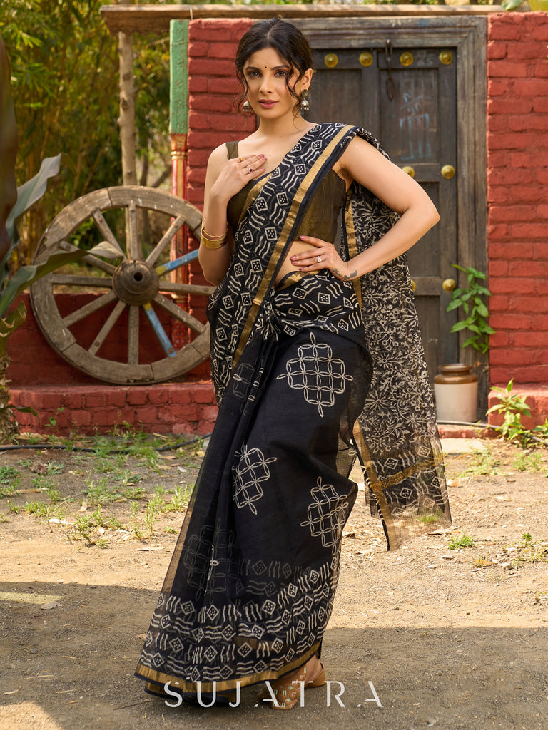 Classic black Kota saree with bold handblock prints and golden borders