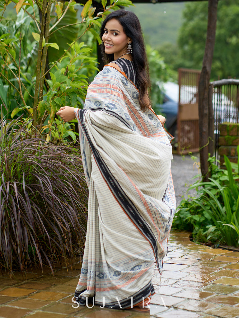 Classic off-white cotton saree with subtle Jamdani-style woven motifs