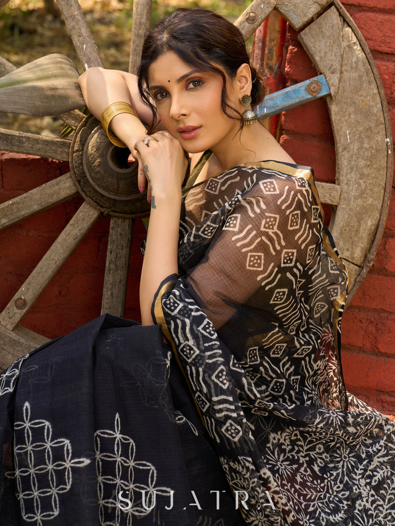 Classic black Kota saree with bold handblock prints and golden borders