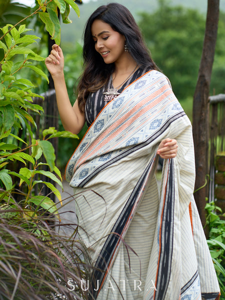 Classic off-white cotton saree with subtle Jamdani-style woven motifs