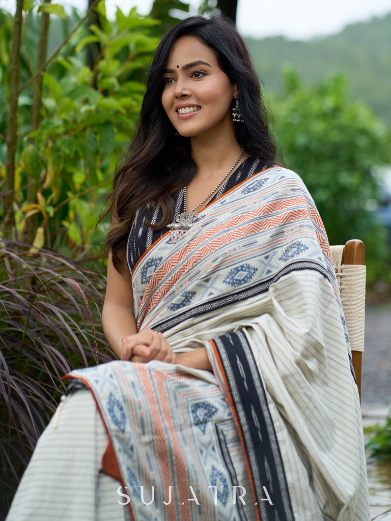 Classic off-white cotton saree with subtle Jamdani-style woven motifs