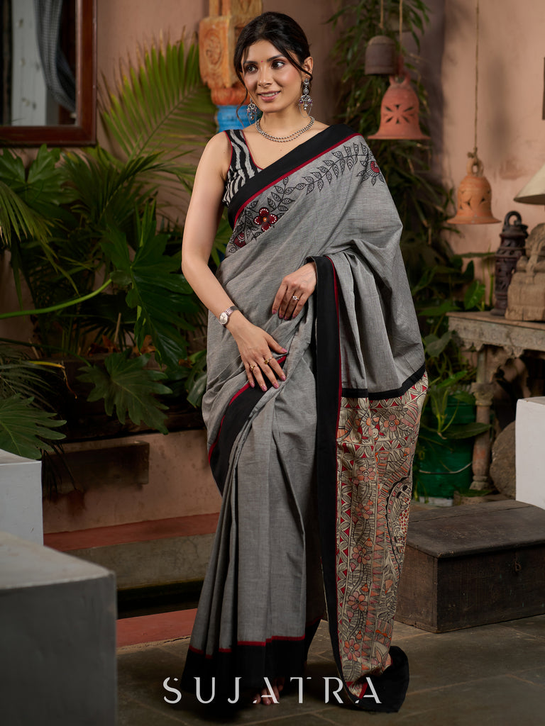 Sophisticated grey cotton saree with bold Madhubani artistry and timeless allure
