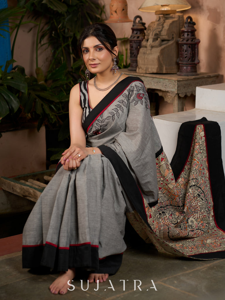 Sophisticated grey cotton saree with bold Madhubani artistry and timeless allure