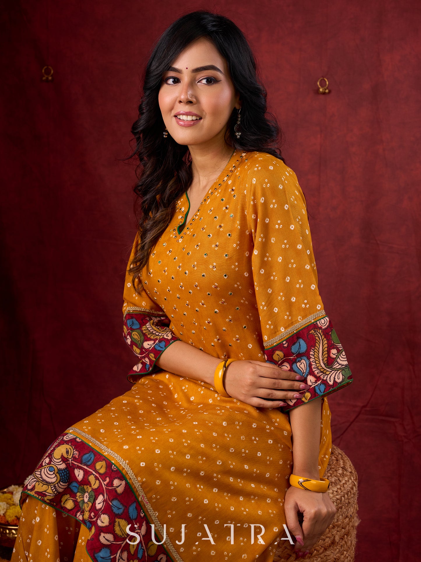 Marigold Yellow Bandhani Asymmetrical Kurta with Kalamkari Accents and Minimal Embellishments