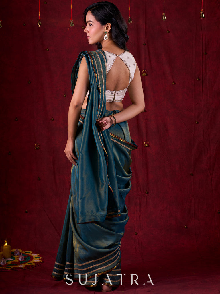 Teal Blue Tissue Saree with Zari Border & Minimal Detailing