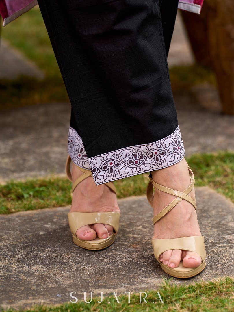 Elegant black cotton pants finished with a traditional Kalamkari border