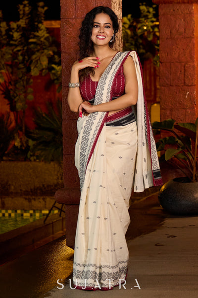 Classic ivory cotton saree adorned with Jamdani-inspired woven motifs