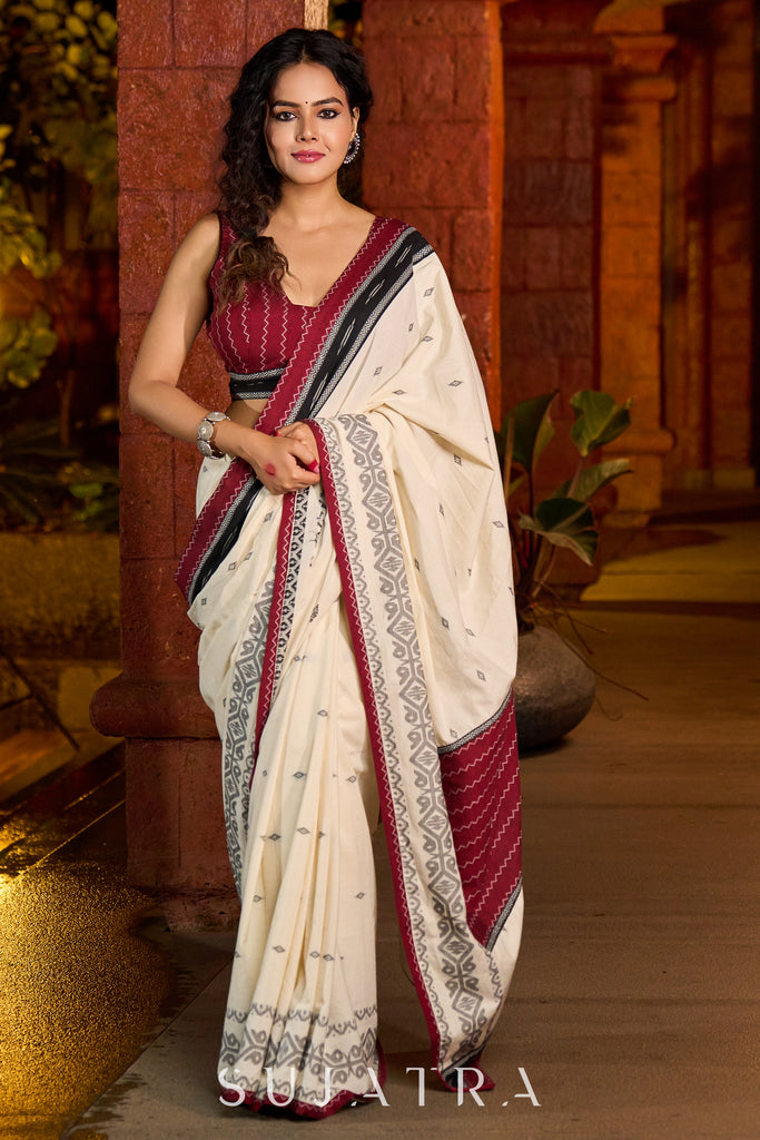 Classic ivory cotton saree adorned with Jamdani-inspired woven motifs