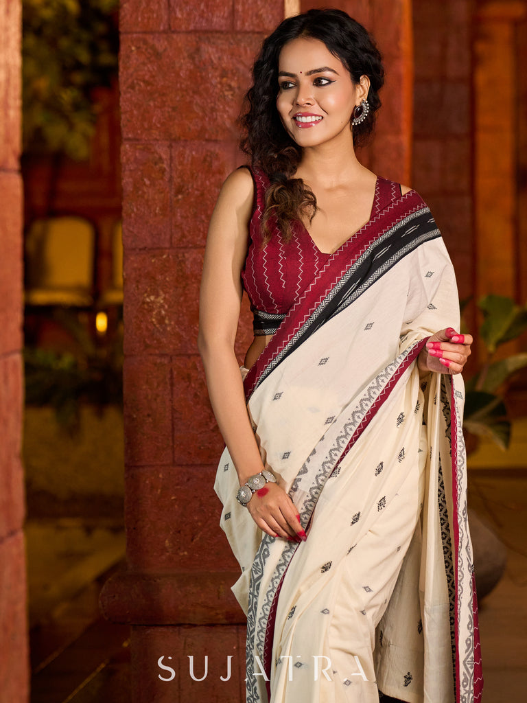 Classic ivory cotton saree adorned with Jamdani-inspired woven motifs
