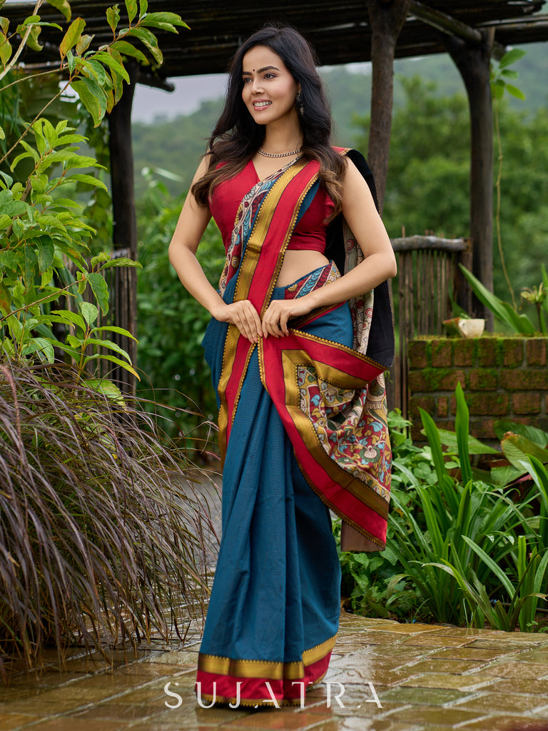 Elegant striped cotton saree in teal, enriched with hand-painted Kalamkari pallu