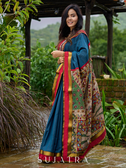 Elegant striped cotton saree in teal, enriched with hand-painted Kalamkari pallu