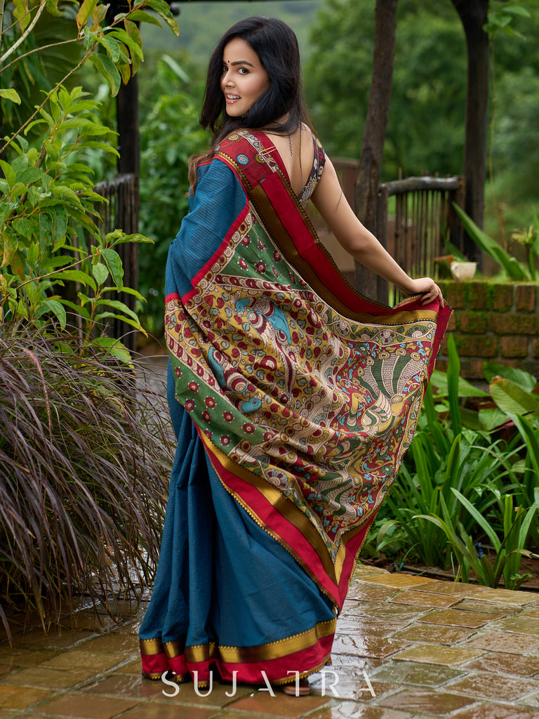 Elegant striped cotton saree in teal, enriched with hand-painted Kalamkari pallu