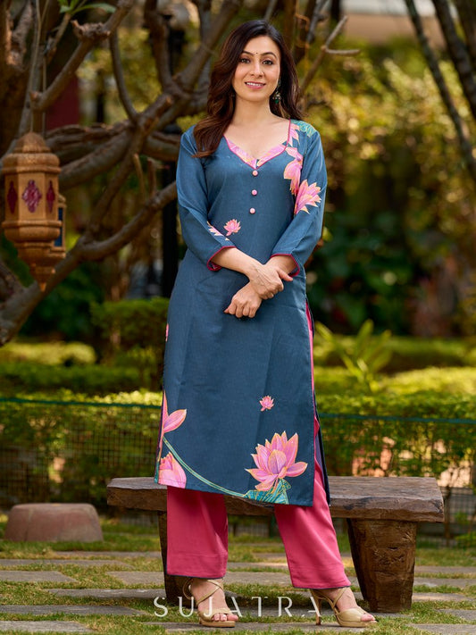 Graceful teal kurta with delicate pink lotus printing, subtle pink accents, and a statement patch above the neckline.