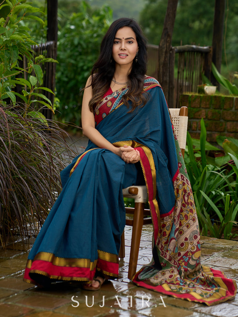 Elegant striped cotton saree in teal, enriched with hand-painted Kalamkari pallu