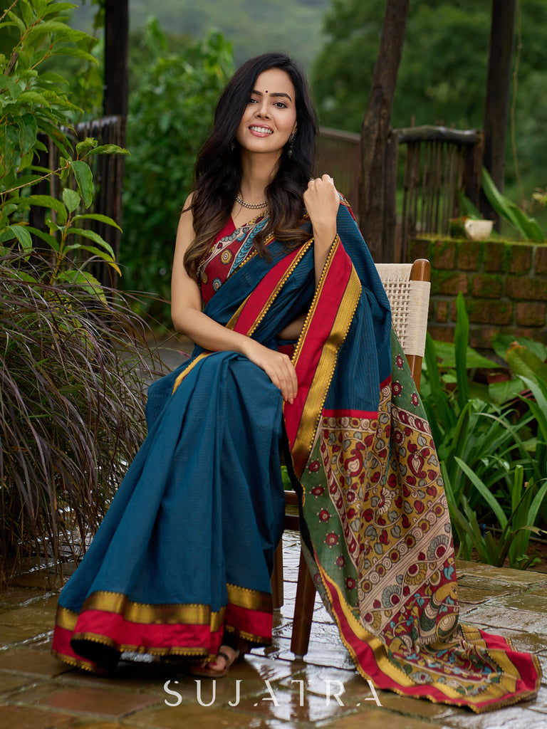 Elegant striped cotton saree in teal, enriched with hand-painted Kalamkari pallu