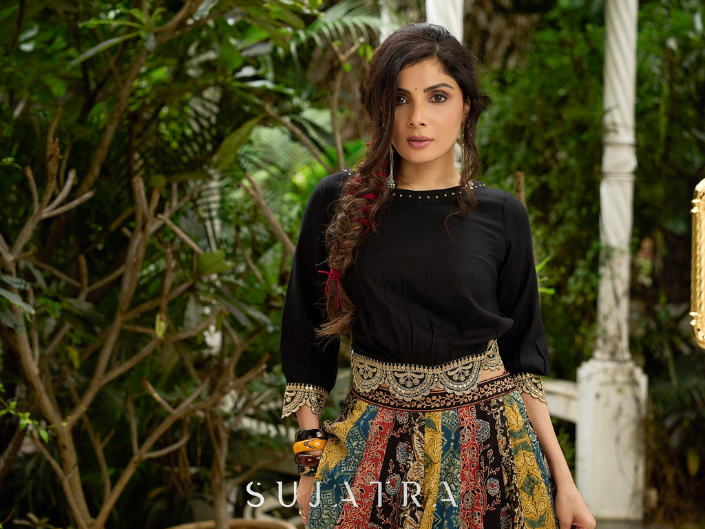 Modern colourful Ajrakh lehenga beautifully contrasted by a sleek black gathered topwear.