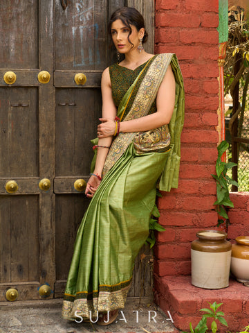 Pastel green semi-silk saree featuring Madhubani artwork on pallu and border