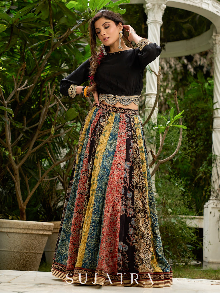 Modern colourful Ajrakh lehenga beautifully contrasted by a sleek black gathered topwear.