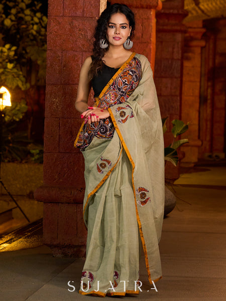 Classic olive Chanderi saree enhanced with heritage batik appliquƩ