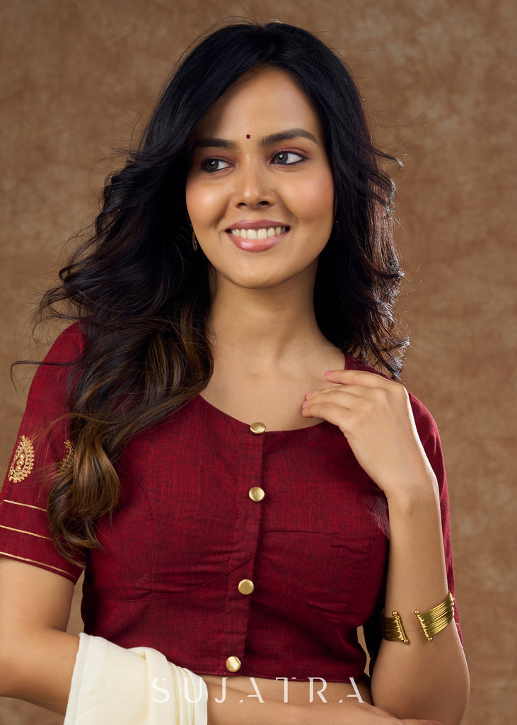 Real elegance : Maroon cotton blouse featuring intricate paisley embroidery perfect for making a sophisticated statement