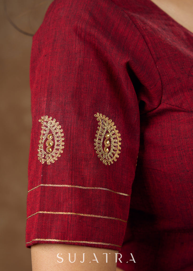 Real elegance : Maroon cotton blouse featuring intricate paisley embroidery perfect for making a sophisticated statement