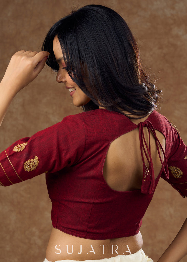 Real elegance : Maroon cotton blouse featuring intricate paisley embroidery perfect for making a sophisticated statement