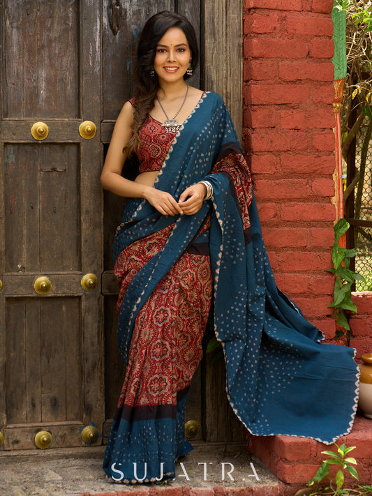 Fusion of Ajrakh charm and Bandhej flair. Rust & Teal cotton Saree