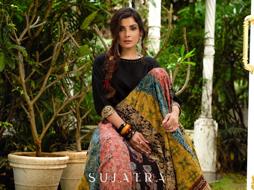 Modern colourful Ajrakh lehenga beautifully contrasted by a sleek black gathered topwear.