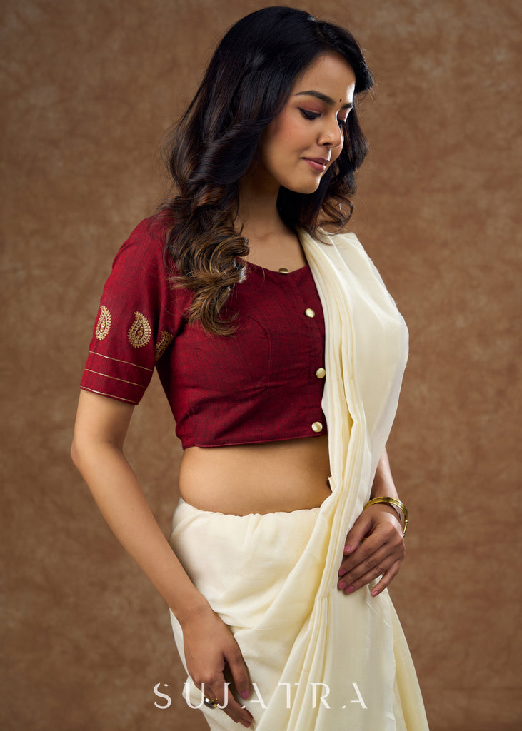 Real elegance : Maroon cotton blouse featuring intricate paisley embroidery perfect for making a sophisticated statement