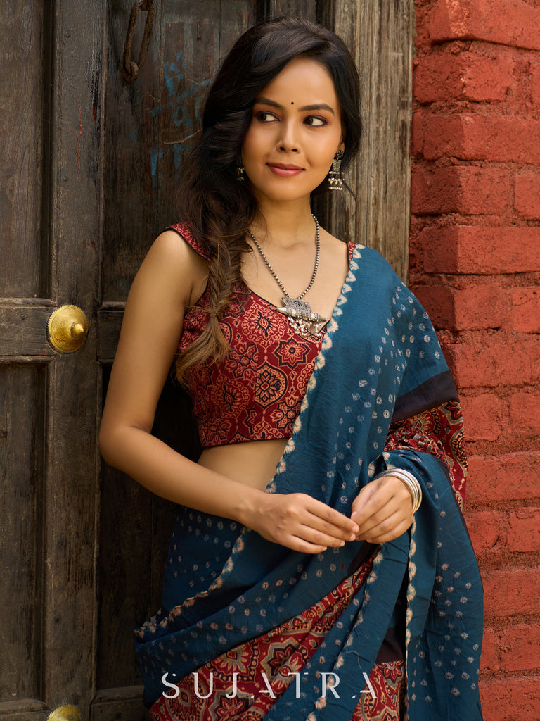 Fusion of Ajrakh charm and Bandhej flair. Rust & Teal cotton Saree