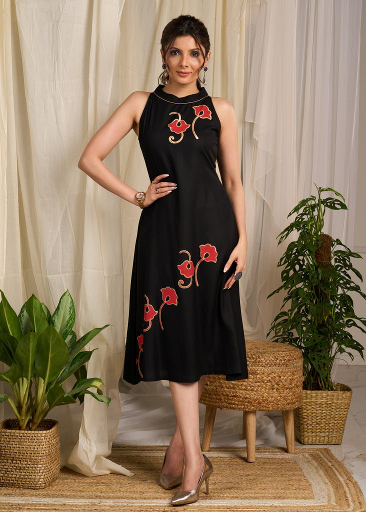 Stunning black rayon dress adorned with vibrant floral block print accents