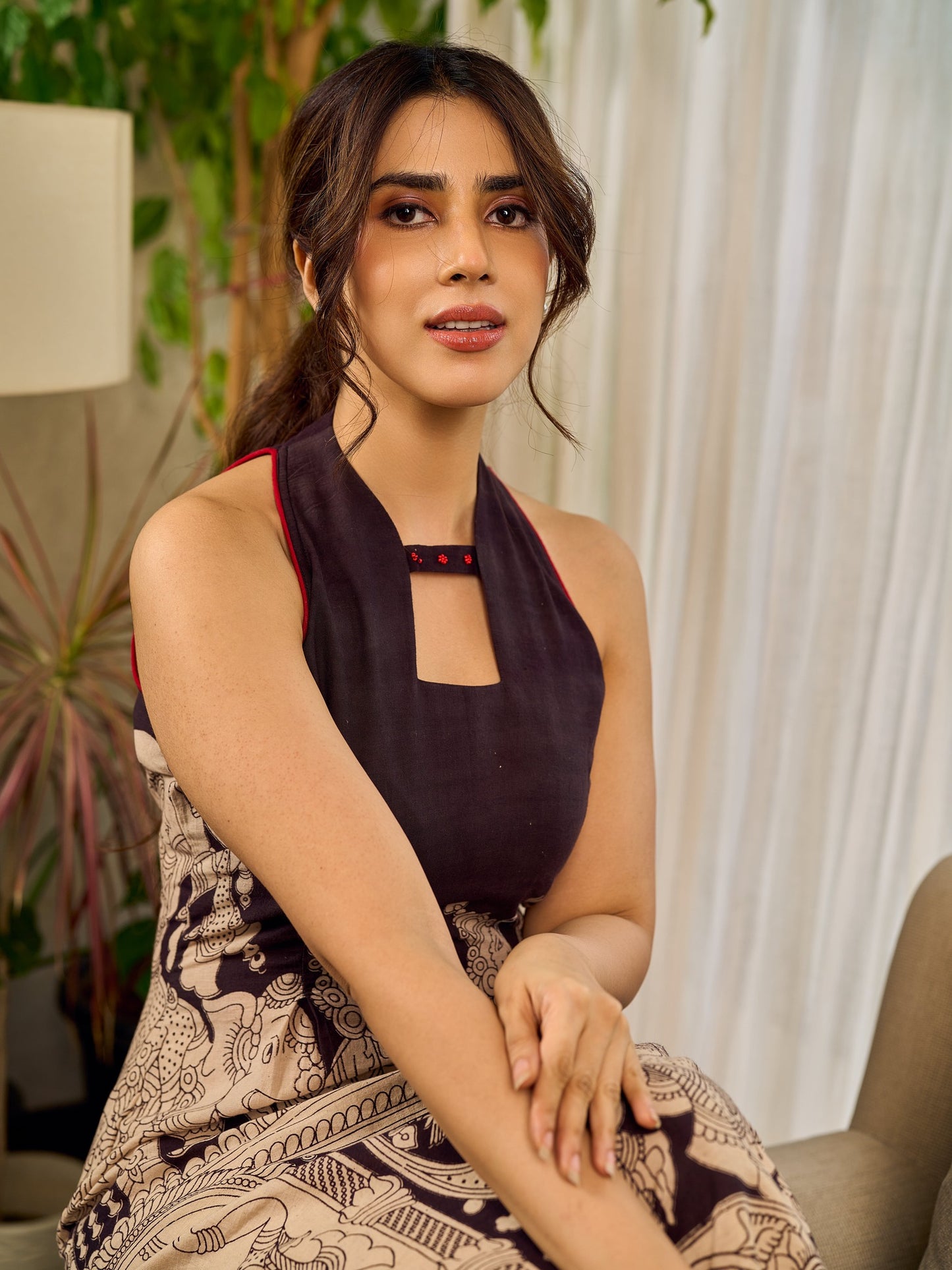 Black Heritage-inspired Kalamkari halter dress with elegant maroon contrast detailing.