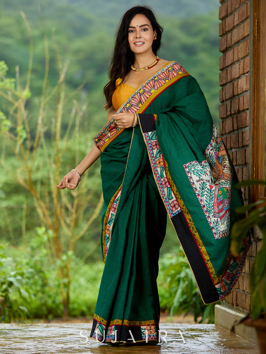 Artisanal cotton saree in bold green with Madhubani hand painted charm