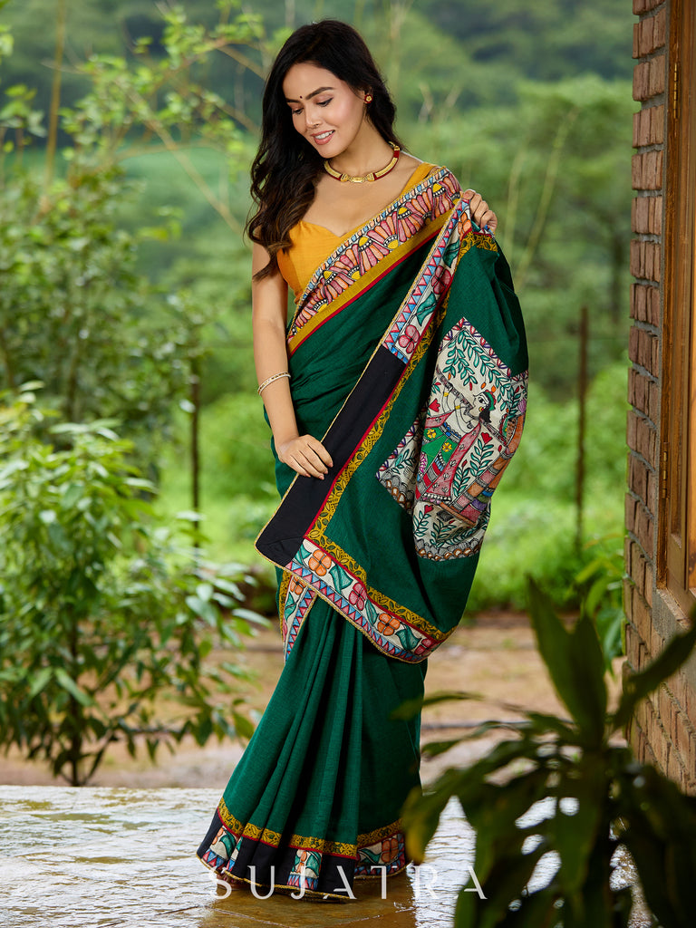 Artisanal cotton saree in bold green with Madhubani hand painted charm